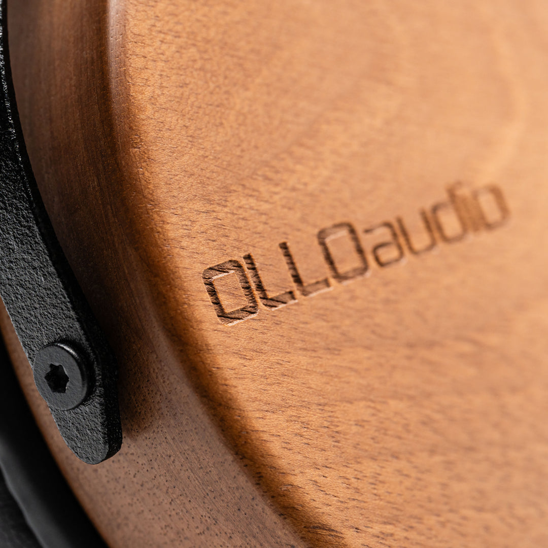 wooden recording studio professional headphones closed-back closeup of the earcup